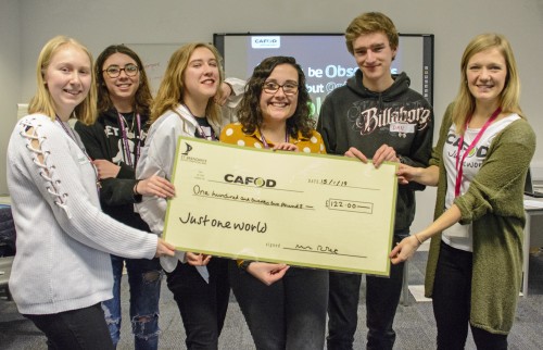 CAFOD students hand over the cheque