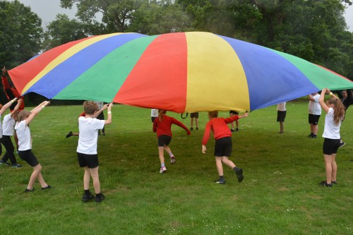 Students have fun with the parachute