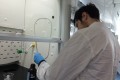 Chemistry Students Working in a Fume Cupboard at College